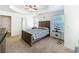 Serene main bedroom featuring a tray ceiling, plush carpet, and natural light at 530 Firethorn Ct, Villa Rica, GA 30180