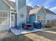 Back patio area featuring outdoor seating, a grill, and access to the home at 530 Firethorn Ct, Villa Rica, GA 30180