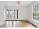 Bright bedroom with wood floors, neutral walls, ceiling fan, and multiple windows offering lots of natural light at 96 Sheridan Dr, Atlanta, GA 30305