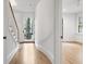 Bright entryway with wooden staircase, light walls, and beautiful hardwood floors at 96 Sheridan Dr, Atlanta, GA 30305