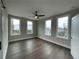 Spacious bedroom with three large windows offering plenty of natural light and views at 968 Bibbs Circle Nw, Atlanta, GA 30318