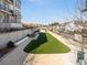 Community lawn with green space and seating areas, set against a backdrop of modern buildings at 968 Bibbs Circle Nw, Atlanta, GA 30318