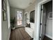 Bright entryway featuring a patterned rug, cozy bench, mirror, and a view of the front door at 968 Bibbs Circle Nw, Atlanta, GA 30318