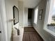 Inviting entryway with natural light, a stylish mirror, bench, and a peek at the staircase at 968 Bibbs Circle Nw, Atlanta, GA 30318