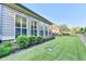 Beautiful backyard featuring a manicured lawn and a row of lush green bushes at 3220 Celebration Blvd, Suwanee, GA 30024