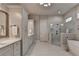 Elegant bathroom featuring modern fixtures, a walk-in shower, and a soaking tub at 3220 Celebration Blvd, Suwanee, GA 30024