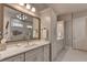 Elegant bathroom with double vanities, large mirrors, custom cabinetry, and modern fixtures at 3220 Celebration Blvd, Suwanee, GA 30024