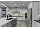 Modern kitchen with stainless steel appliances, custom cabinetry, and a sleek design at 3220 Celebration Blvd, Suwanee, GA 30024