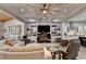 Bright living room featuring a coffered ceiling, fireplace, and comfortable seating, creating a cozy atmosphere at 3220 Celebration Blvd, Suwanee, GA 30024