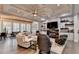 Open living space with hardwood flooring, coffered ceilings, fireplace, and adjacent dining area at 3220 Celebration Blvd, Suwanee, GA 30024