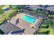 An aerial view of the community pool with lounge chairs and an immaculate deck at 3220 Celebration Blvd, Suwanee, GA 30024