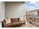 Relaxing balcony with cozy rattan seating, throw pillows, and a charming view at 2111 Lilly Nw Way, Atlanta, GA 30318