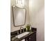 Elegant bathroom with a modern sink, granite countertop, and decorative mirror at 2111 Lilly Nw Way, Atlanta, GA 30318