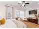 Spacious bedroom featuring sitting area, flat-screen TV and decor at 2111 Lilly Nw Way, Atlanta, GA 30318