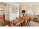 Stylish dining room with hardwood floors, modern light fixture, and access to kitchen at 2111 Lilly Nw Way, Atlanta, GA 30318