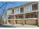 Townhome featuring multiple levels with private balconies and attached garages, all set on a quiet street at 2111 Lilly Nw Way, Atlanta, GA 30318