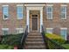 Charming brick home with well-maintained landscaping, stone staircase, and inviting front entrance at 2111 Lilly Nw Way, Atlanta, GA 30318