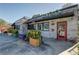 Charming brick exterior of a TACO restaurant with colorful planters and decor at 2111 Lilly Nw Way, Atlanta, GA 30318