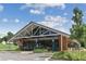 A modern STAR Provisions building with ample windows and outdoor seating area at 2111 Lilly Nw Way, Atlanta, GA 30318