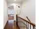 Hallway showcasing stairs and view of connected living room at 2111 Lilly Nw Way, Atlanta, GA 30318