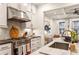 Well-appointed kitchen with marble countertops, stainless steel appliances, and stylish backsplash at 2111 Lilly Nw Way, Atlanta, GA 30318