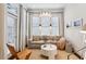 Cozy living room features a large window for natural light, neutral tones, and contemporary decor at 2111 Lilly Nw Way, Atlanta, GA 30318