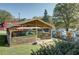 Charming outdoor dining area with a wooden pavilion, surrounded by lush greenery for a delightful experience at 2111 Lilly Nw Way, Atlanta, GA 30318