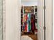 Well-organized walk-in closet features ample shelving and hanging space for optimal storage at 2111 Lilly Nw Way, Atlanta, GA 30318