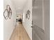 Inviting hallway features hardwood floors, recessed lighting and modern wall decorations at 225 Epping St # 92, Stockbridge, GA 30281