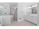 Bathroom featuring double vanity, glass shower, and modern fixtures with tile at 305 Brassy Ct, Alpharetta, GA 30022