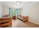 Bedroom with hardwood floors, a large window, and two beds with matching nightstands at 305 Brassy Ct, Alpharetta, GA 30022