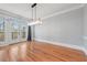 Bright dining room with hardwood floors and access to an outdoor deck at 305 Brassy Ct, Alpharetta, GA 30022