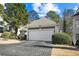 The home has a spacious two-car garage with a paved driveway at 305 Brassy Ct, Alpharetta, GA 30022