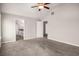 Bright main bedroom with vaulted ceiling, neutral carpet, and multiple entry points at 325 Nutwood Trce, Locust Grove, GA 30248