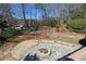 Elevated backyard stone patio with fire pit at 3894 Stone Lake Nw Dr, Kennesaw, GA 30152