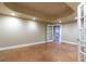 Open basement featuring stained concrete flooring and a walkout to the backyard at 3894 Stone Lake Nw Dr, Kennesaw, GA 30152