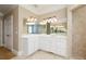 Bathroom featuring double sink vanity with white cabinets and granite counters at 3894 Stone Lake Nw Dr, Kennesaw, GA 30152