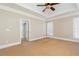 Spacious bedroom with trey ceilings, large windows, and neutral carpet at 3894 Stone Lake Nw Dr, Kennesaw, GA 30152