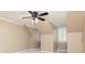 Bright bedroom featuring neutral paint, plush carpet, a ceiling fan, and a window with shutter blinds at 3894 Stone Lake Nw Dr, Kennesaw, GA 30152