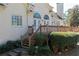 Back deck with stairs down to the backyard and a view of the landscaped yard at 3894 Stone Lake Nw Dr, Kennesaw, GA 30152