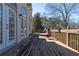 Wooden deck with railing, offering an outdoor space for relaxation and enjoying the surrounding scenery at 3894 Stone Lake Nw Dr, Kennesaw, GA 30152