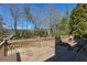 Wooden deck with railing offering scenic views of the surrounding landscape and trees at 3894 Stone Lake Nw Dr, Kennesaw, GA 30152