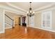 Dining room with hardwood floors, decorative chandelier, and access to other rooms at 3894 Stone Lake Nw Dr, Kennesaw, GA 30152