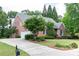 Well-maintained brick home with a driveway and manicured lawn and landscaping at 3894 Stone Lake Nw Dr, Kennesaw, GA 30152