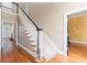 Beautiful foyer featuring a staircase, hardwood floors, and natural light from nearby windows at 3894 Stone Lake Nw Dr, Kennesaw, GA 30152