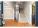 Grand foyer with hardwood floors, staircase, and views into adjoining rooms at 3894 Stone Lake Nw Dr, Kennesaw, GA 30152