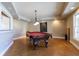 Recreation room featuring a pool table, wet bar, and a large window for ample natural light at 3894 Stone Lake Nw Dr, Kennesaw, GA 30152