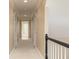 Upstairs hallway with carpet flooring, base trim, and natural light from nearby windows at 3894 Stone Lake Nw Dr, Kennesaw, GA 30152