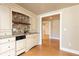 Basement kitchenette with granite countertops, a tile backsplash, and stainless steel dishwasher at 3894 Stone Lake Nw Dr, Kennesaw, GA 30152