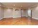 A living room with neutral walls and stained concrete floors at 3894 Stone Lake Nw Dr, Kennesaw, GA 30152